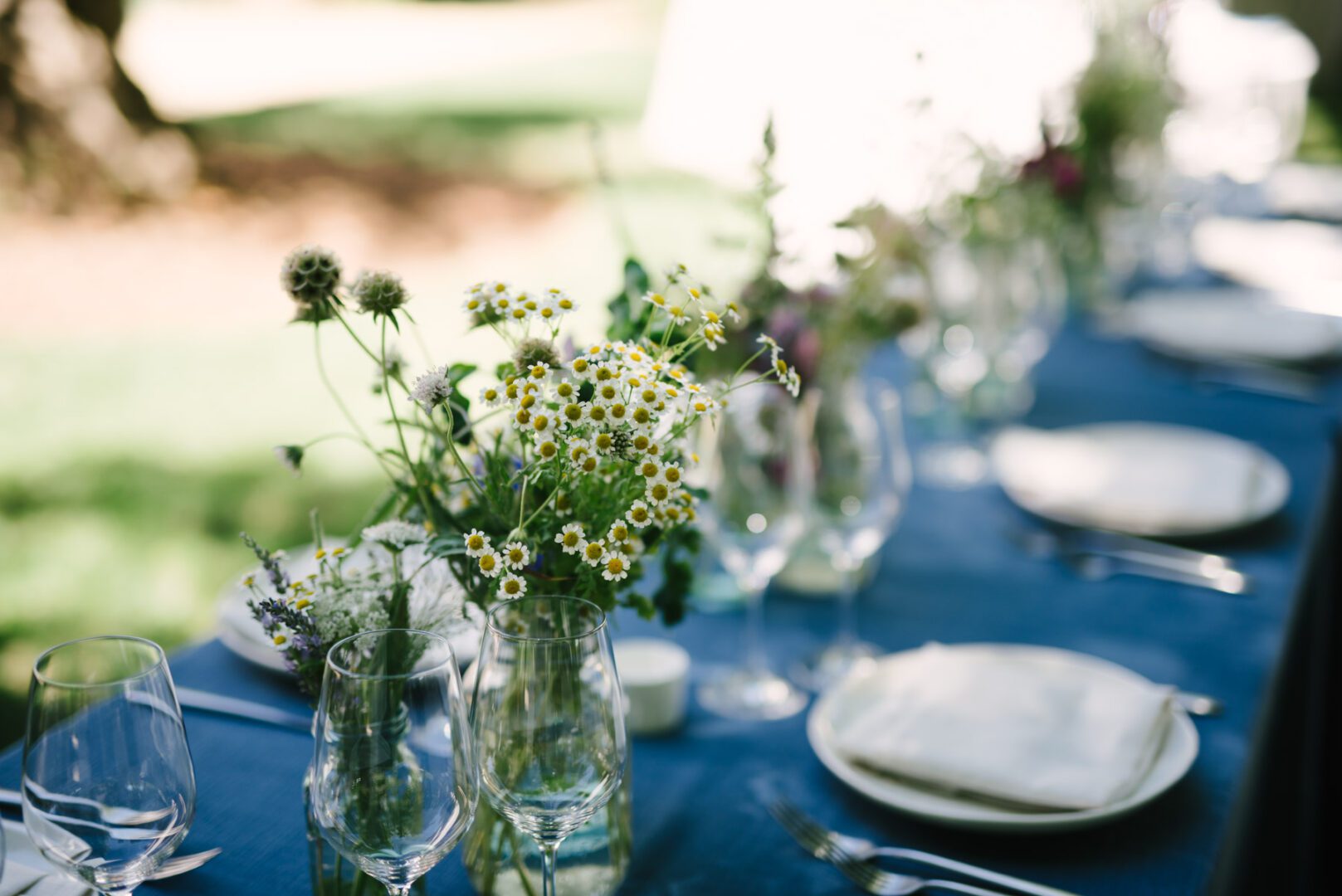 A blue tablecloth with flowers on it.