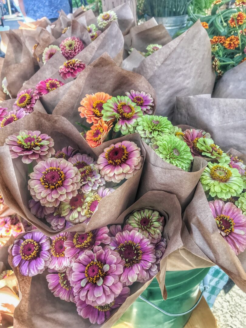 Zinnias for sale at a farmers market.
