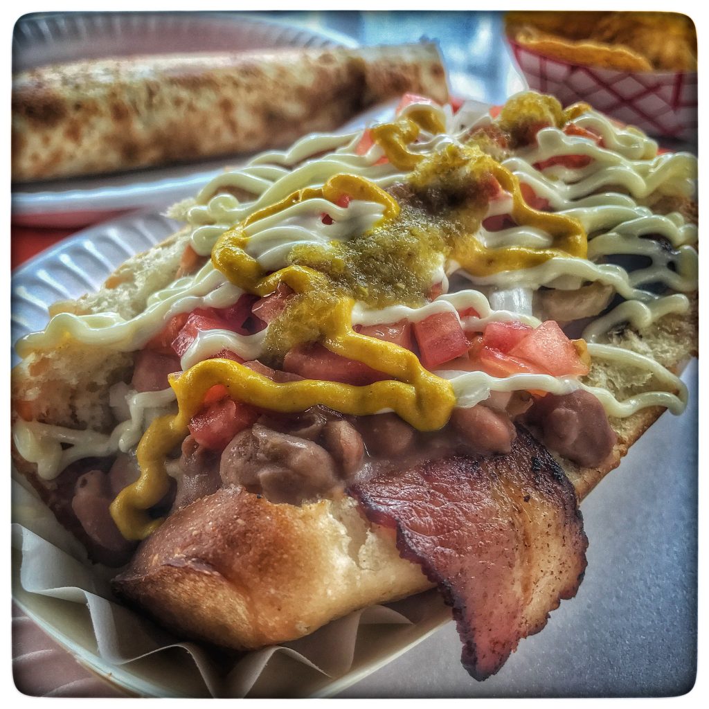 A hot dog on a plate.