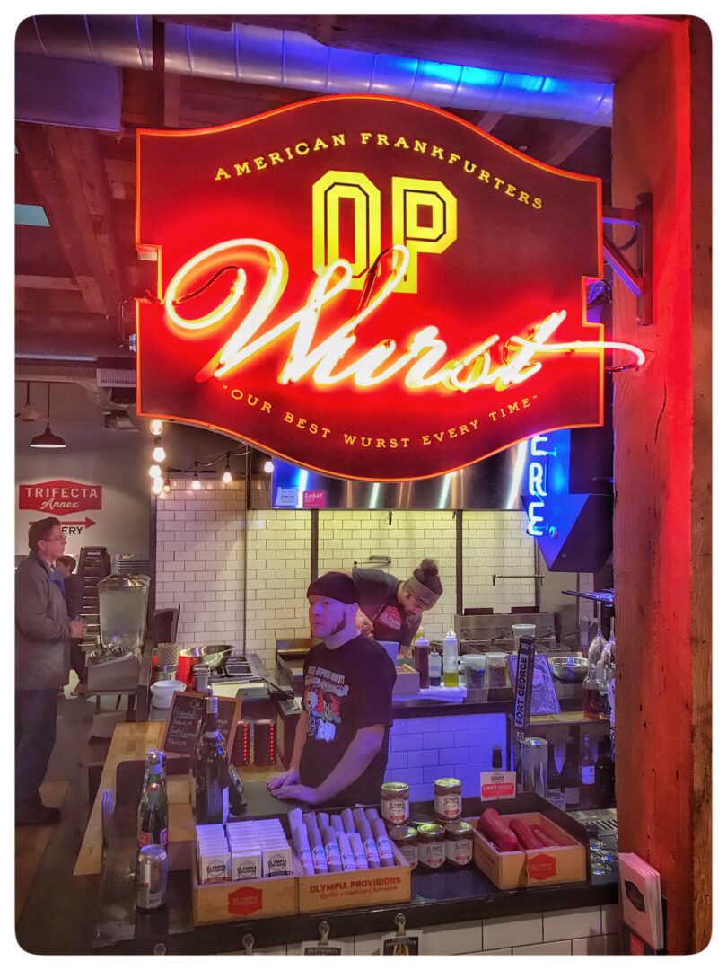A neon sign that says op wurst.