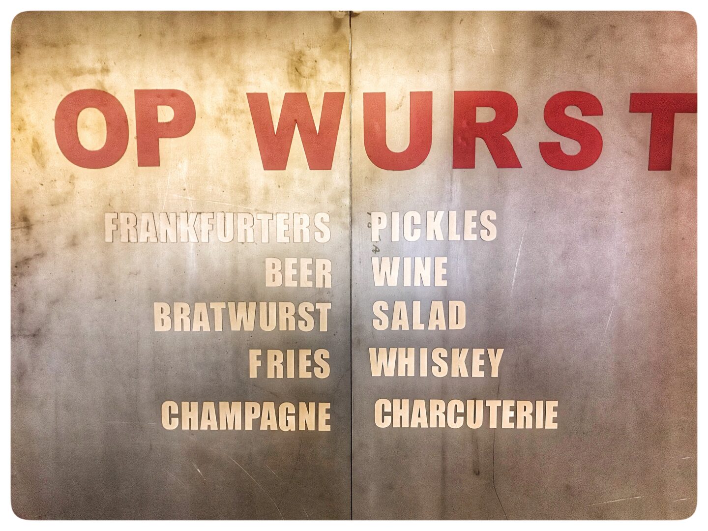 A sign that reads top wurst.
