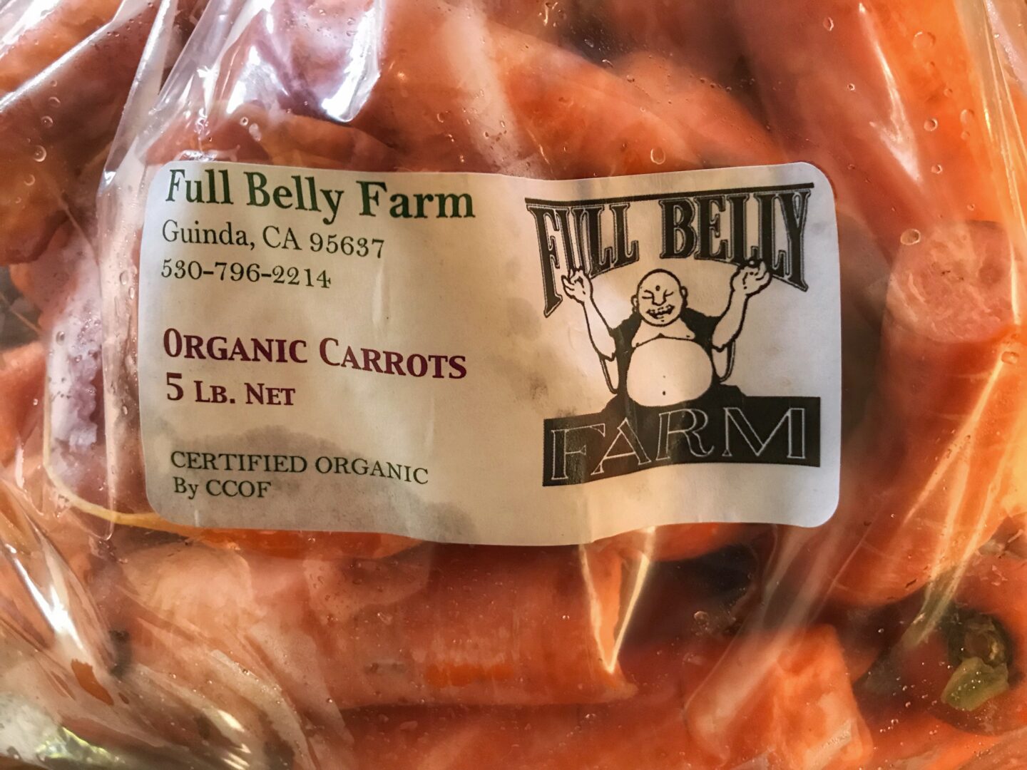 A bag of organic carrots in a plastic bag.