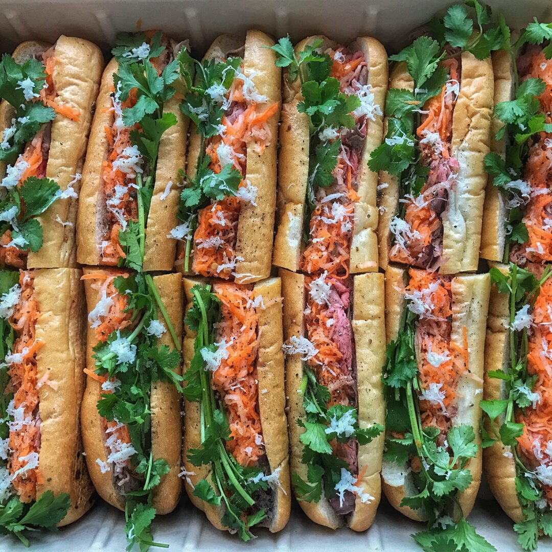 A box of vietnamese hot dogs.