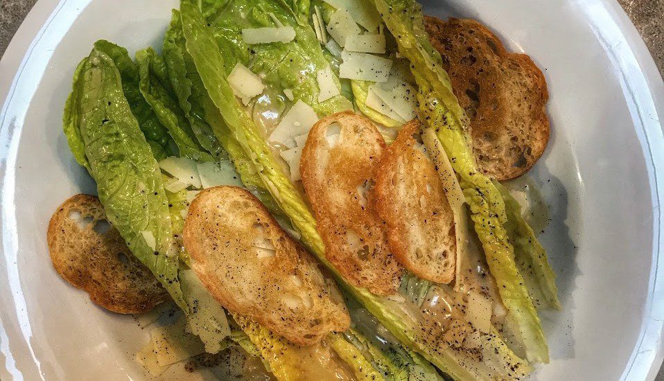 Caesar salad with croutons and parmesan.