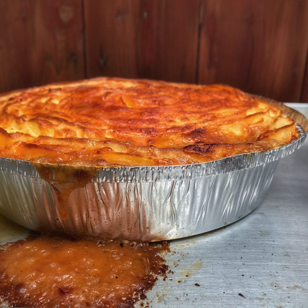 A pie is sitting on top of a metal pan.
